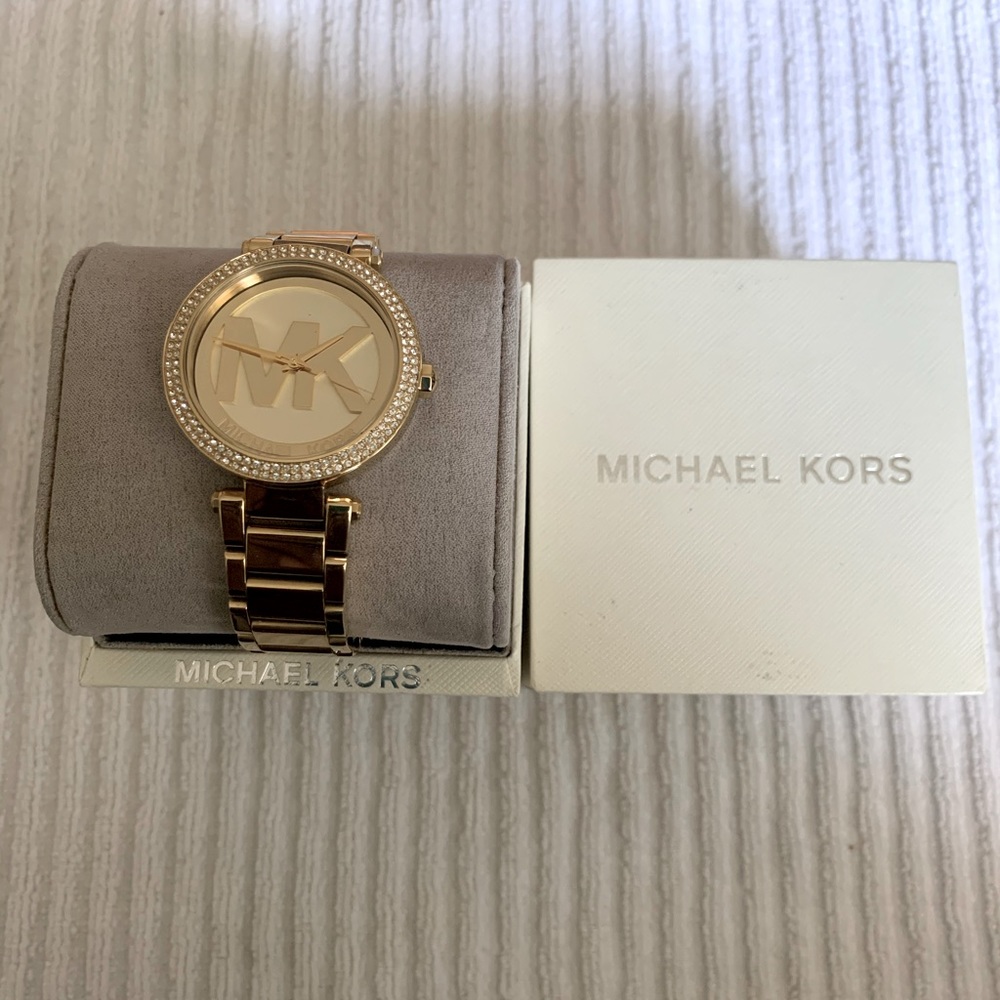 Michael Kors Watch is used and has a few scratches
